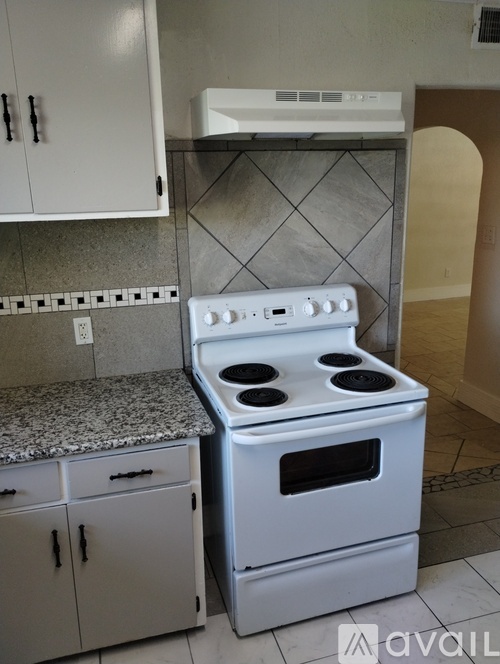 A white stove and oven in a kitchen.