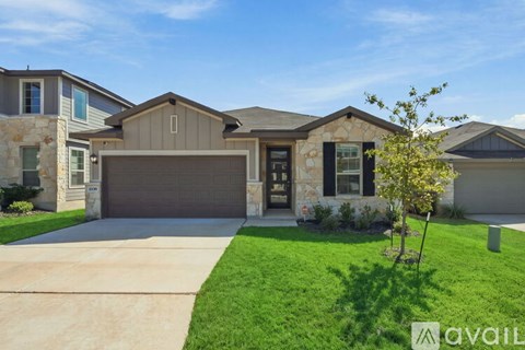 A house with a brown garage door is for sale.