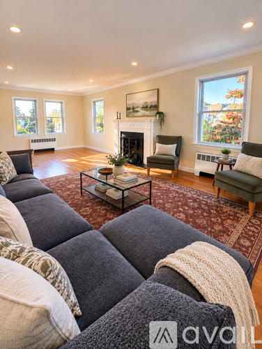 A living room with a fireplace and a couch.
