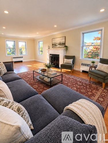 A living room with a fireplace and a couch.