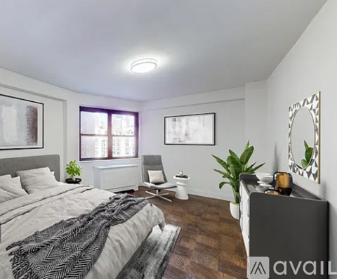 A bedroom with a large bed and a mirror on the wall.