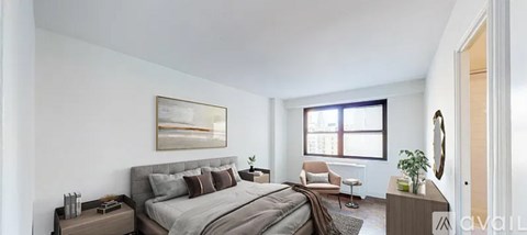 A bedroom with a large bed and a chair.