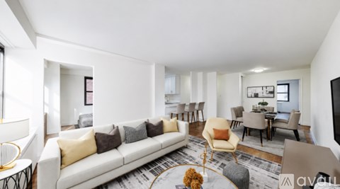 A living room with a white couch and a coffee table.