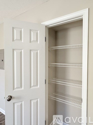 A white door with a handle and a white interior.