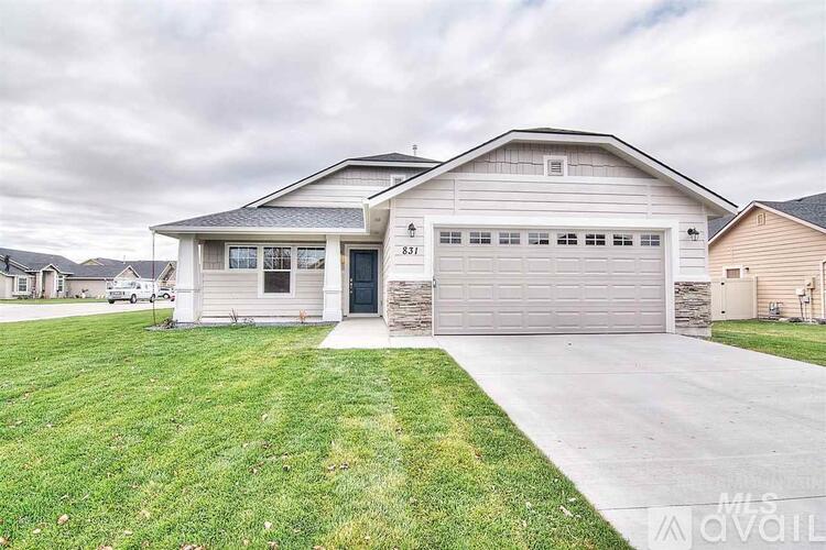 A two-story house with a garage is for sale.