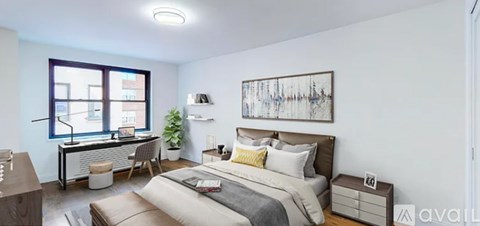 A bedroom with a large bed and a painting on the wall.