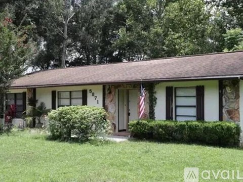 A house with a flag on the front porch.
