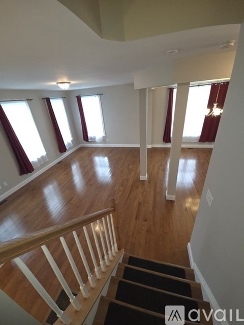 A large open space with a staircase leading to the second floor.