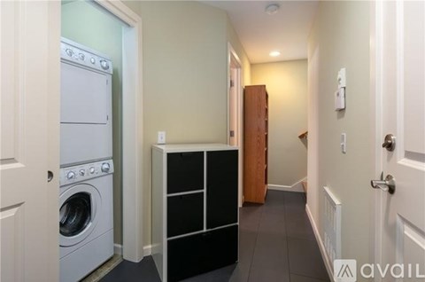 A laundry room with a washer and dryer.