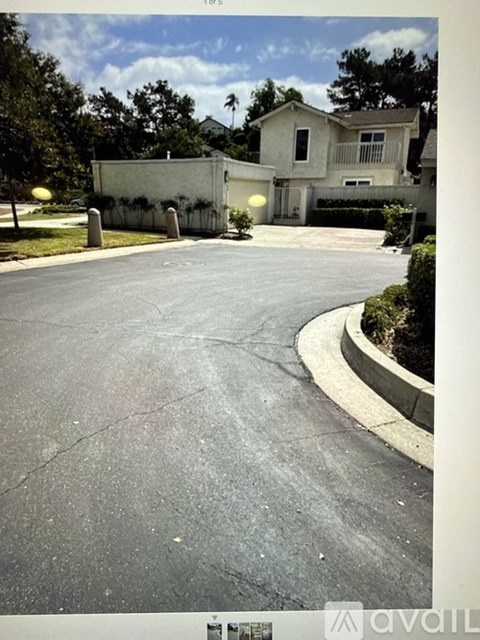 A house with a driveway in front of it.