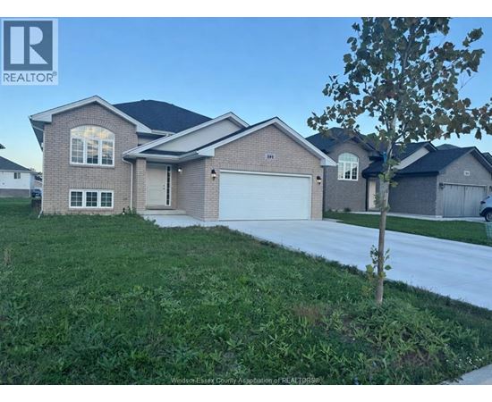 A house with a REALTOR® sign in front of it.