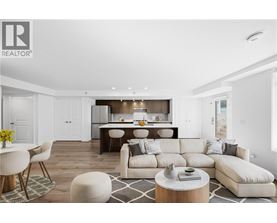 A modern living room with a large white sofa and a dining area in the background.