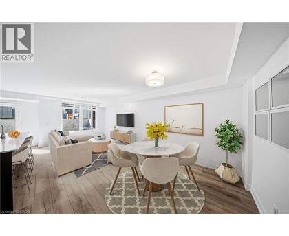 A well-lit, modern dining room with a table set for four.