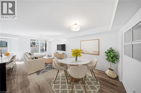 A well-lit, modern dining room with a table set for four.