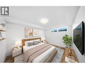 A bedroom with a large bed and a flat screen TV mounted on the wall.
