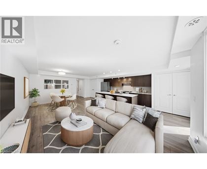 A modern living room with a white sofa and a coffee table.
