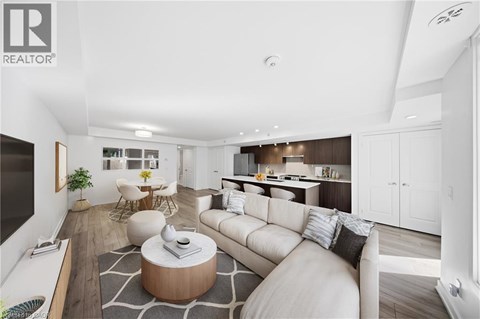 A modern living room with a white sofa and a coffee table.