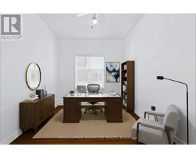 A room with a desk and a chair.