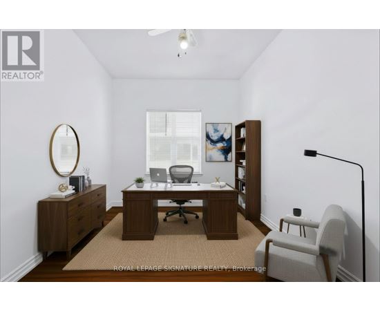 A room with a desk and a chair.