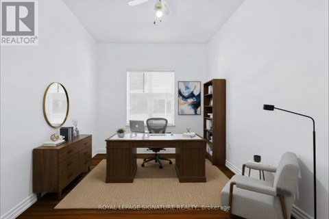 A room with a desk and a chair.