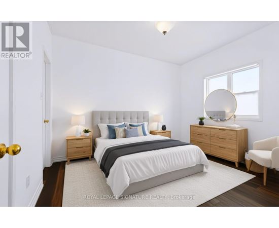 A bedroom with a bed, nightstands, and a chair.