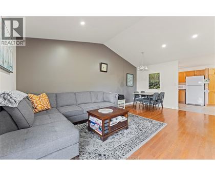 A living room with a grey couch and a coffee table.
