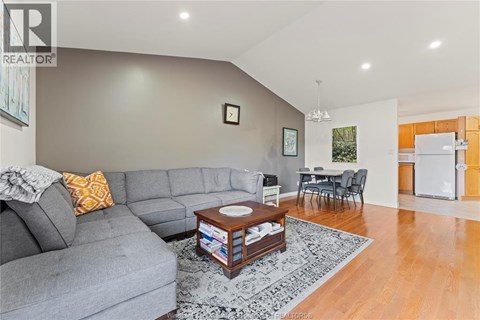A living room with a grey couch and a coffee table.