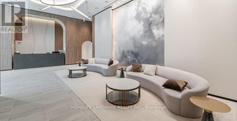 A modern living room with a large sofa and a coffee table.