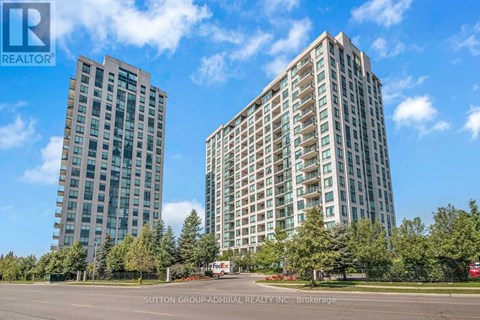 Two tall buildings are shown in the image with a blue sky in the background.