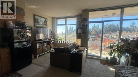 A living room with a couch and a television set.