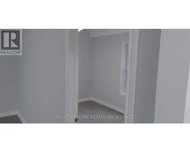 A room with a white door and a window.