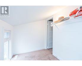 A room with a white door and a window with a white frame.