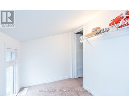 A room with a white door and a window with a white frame.