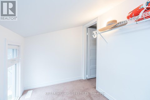 A room with a white door and a window with a white frame.