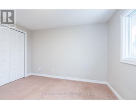 A room with a white door and a window with a white frame.
