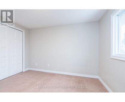 A room with a white door and a window with a white frame.