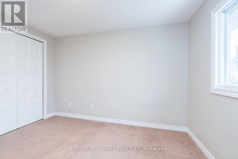 A room with a white door and a window with a white frame.