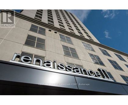 A tall building with the name Renaissance on it.