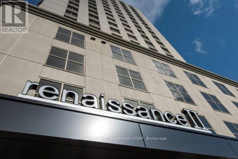 A tall building with the name Renaissance on it.