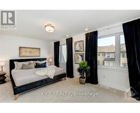 A bedroom with a large bed and a view of the city.