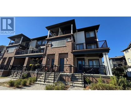 A multi-story residential building with balconies and a clear blue sky.