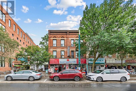 A street view with cars and buildings.