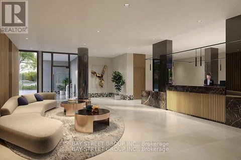 A modern living room with a curved sofa and a coffee table in the center.