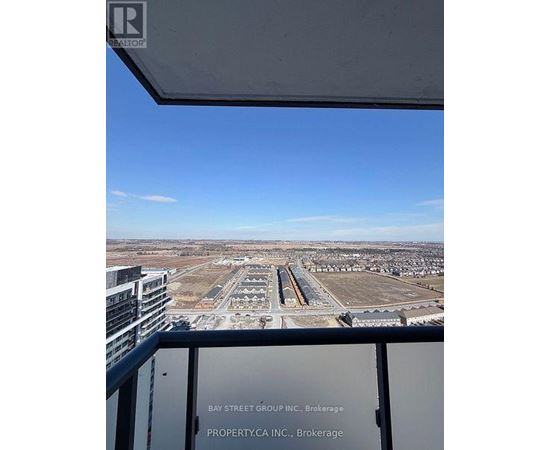 A view from a high-rise building looking out over a large, empty parking lot.