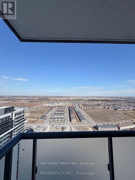 A view from a high-rise building looking out over a large, empty parking lot.