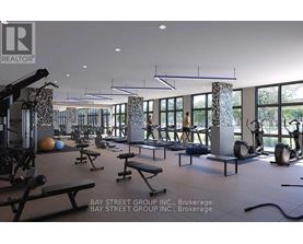 A gym with a variety of equipment including weights and benches.