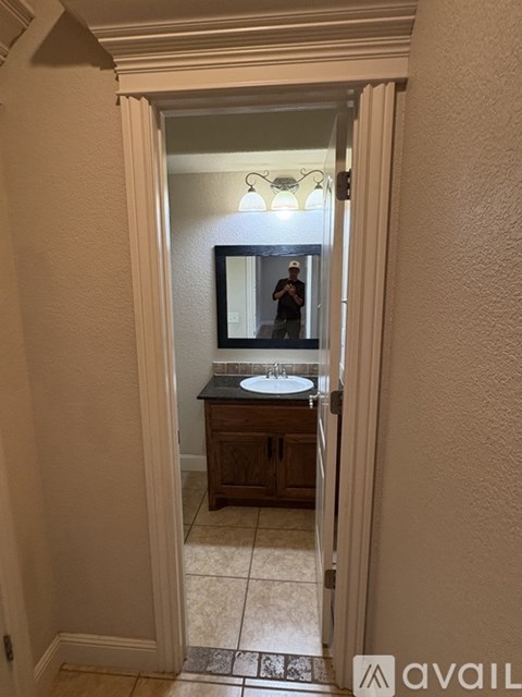 A man is taking a selfie in a bathroom.