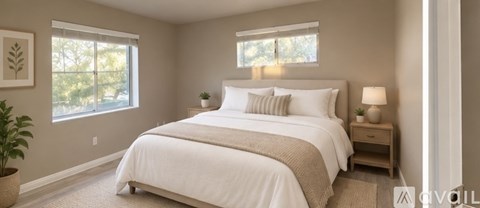 A bedroom with a large bed and a window.