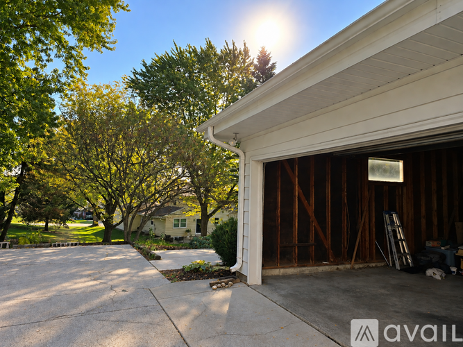 A house with a garage under construction.