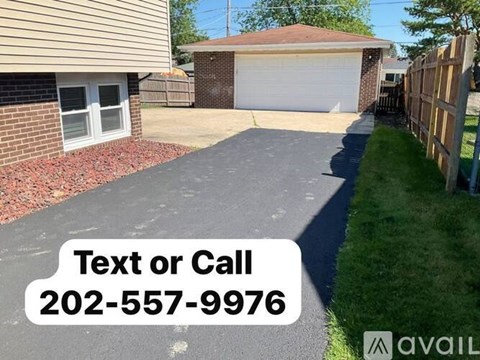 A residential driveway with a text overlay offering contact information.